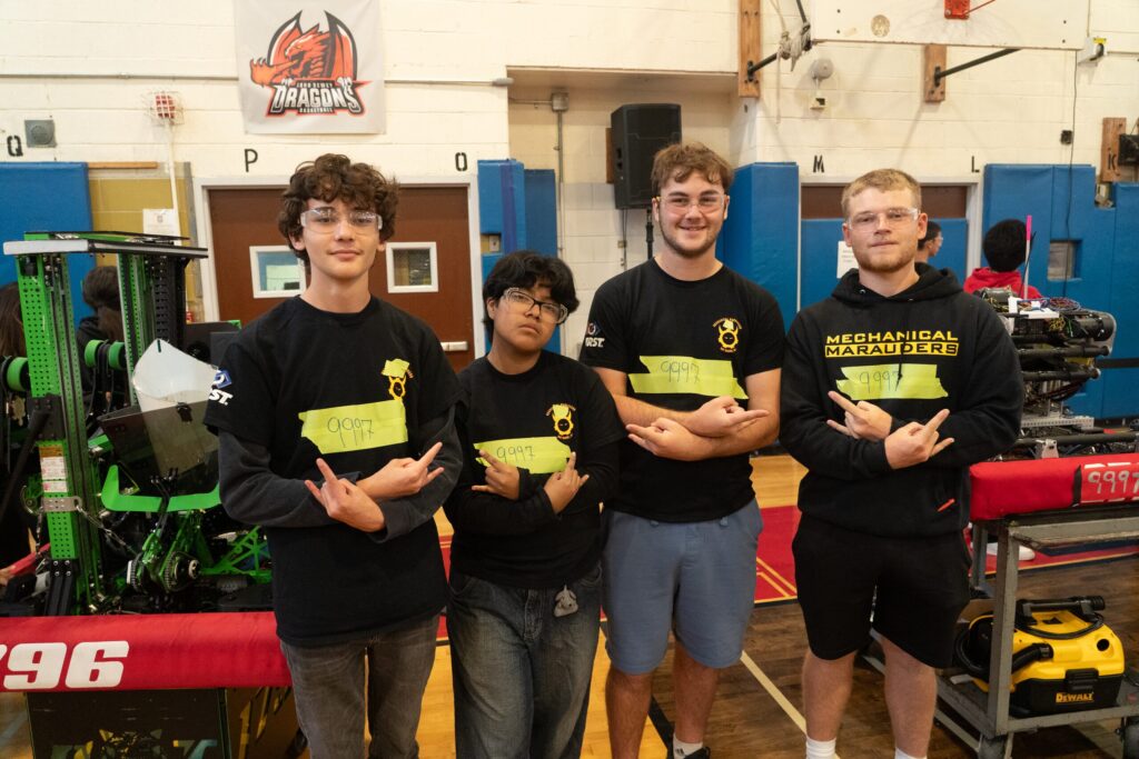 Team 271 Mechanical Marauders students and robot at competitions and in the shop