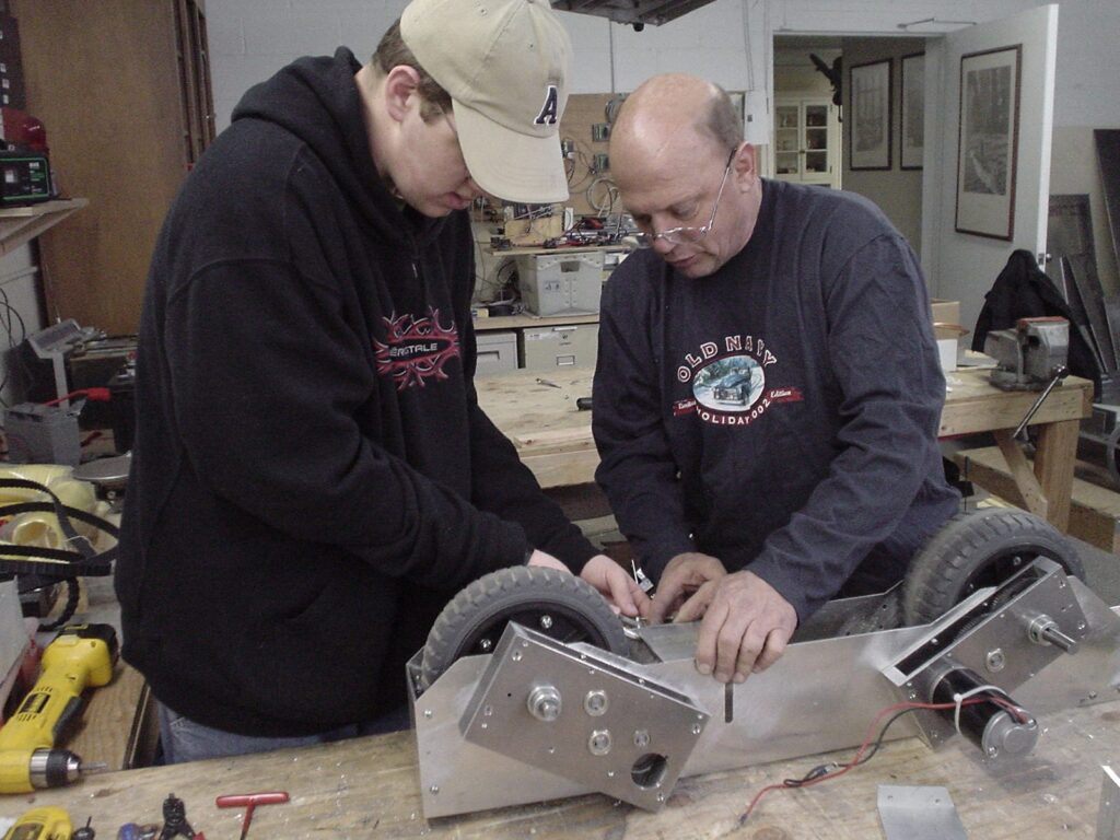 Pete Burke building a gearbox with a student, 2004