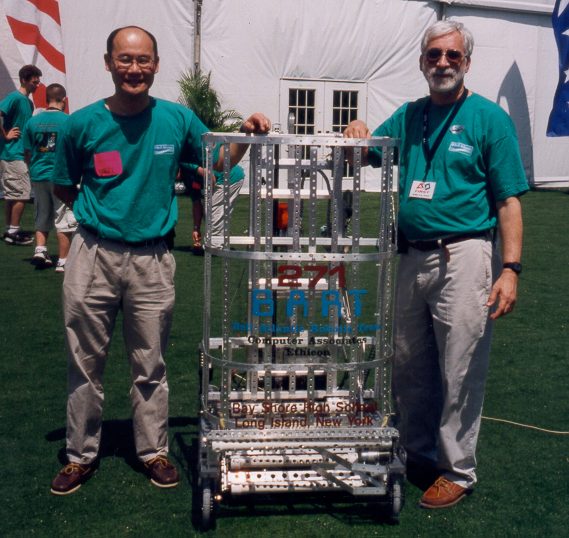 Sully Chen with a fellow mentor and the 2000 robot