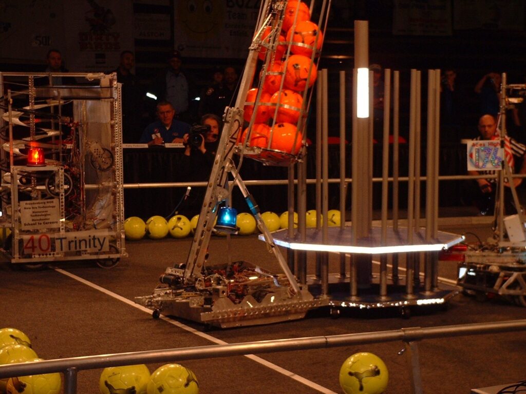 Team 271 2002 robot lifting balls into the goal