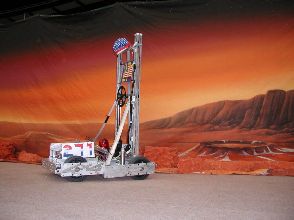 Team 271 2003 robot in front of a Mars backdrop