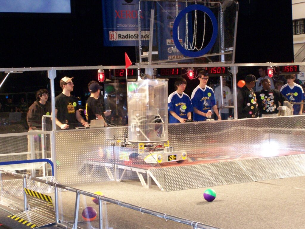 Team 271 2006 robot with clear cylinder on the field